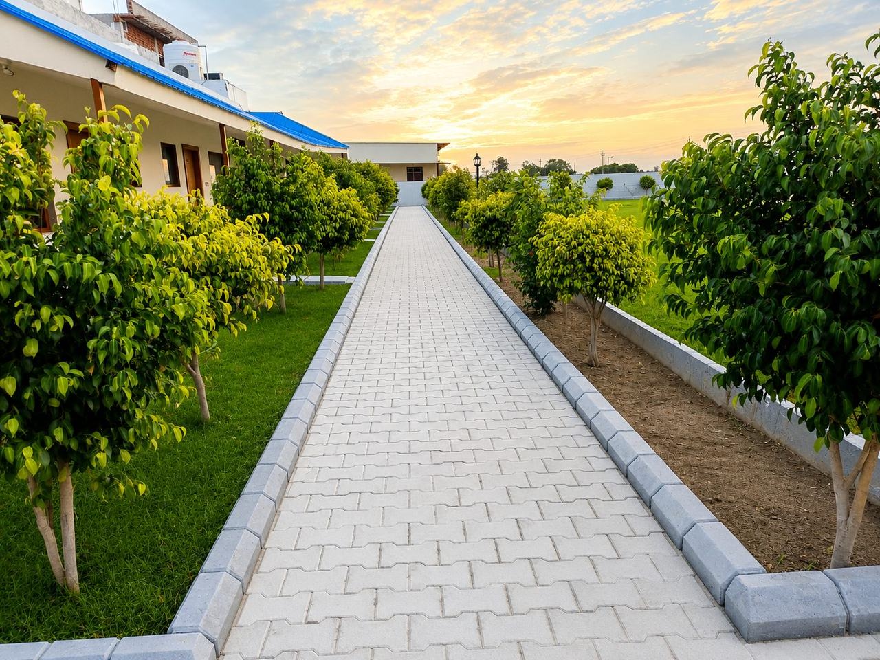 Vanam Hotel & Resorts walkway at sunset